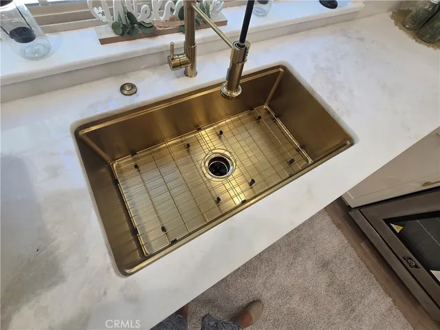 a view of a yard with plants and trees