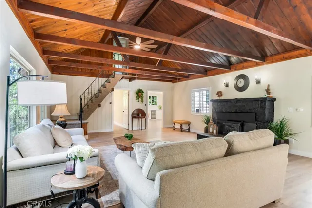 a living room with furniture and a clock