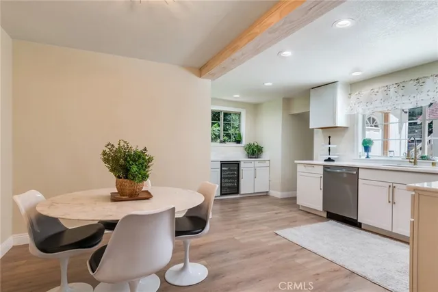 a kitchen with a table and chairs in it
