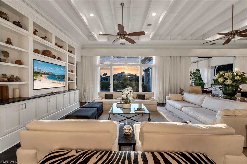 2157 Asti Court Naples, FL 34105 - Photo 2 of 29 At sunset, this incredible home becomes even more desirable, as the sun sets its and this home becomes a cozy retreat.