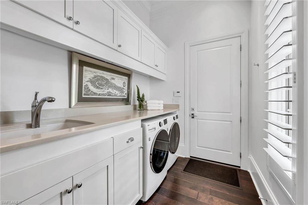 2157 Asti Court Naples, FL 34105 - Photo 23 of 29 Even the laundry room has quartzite counter, abundant storage, deep sink, and espresso wood flooring.