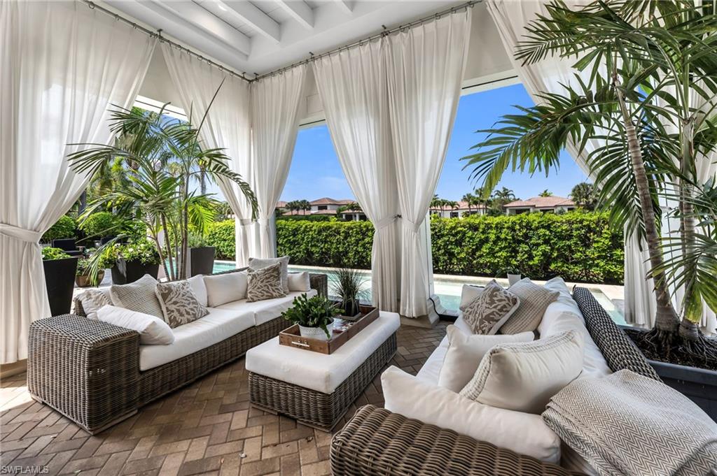 2157 Asti Court Naples, FL 34105 - Photo 24 of 29 Ready to curl up with a good book and a coffee? This feels like a charming, European boutique hotel lanai