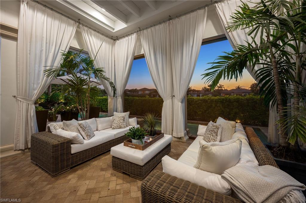 2157 Asti Court Naples, FL 34105 - Photo 25 of 29 ....this lanai becomes even more inviting at sunset time.