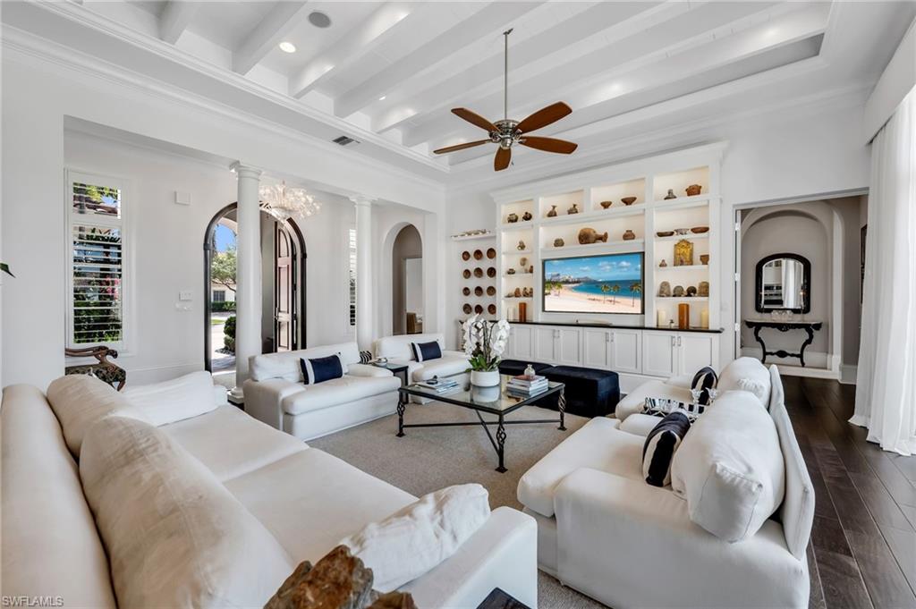 2157 Asti Court Naples, FL 34105 - Photo 8 of 29 Fabulous great room with unique ceiling details, espresso wood flooring, and bespoke built-ins.