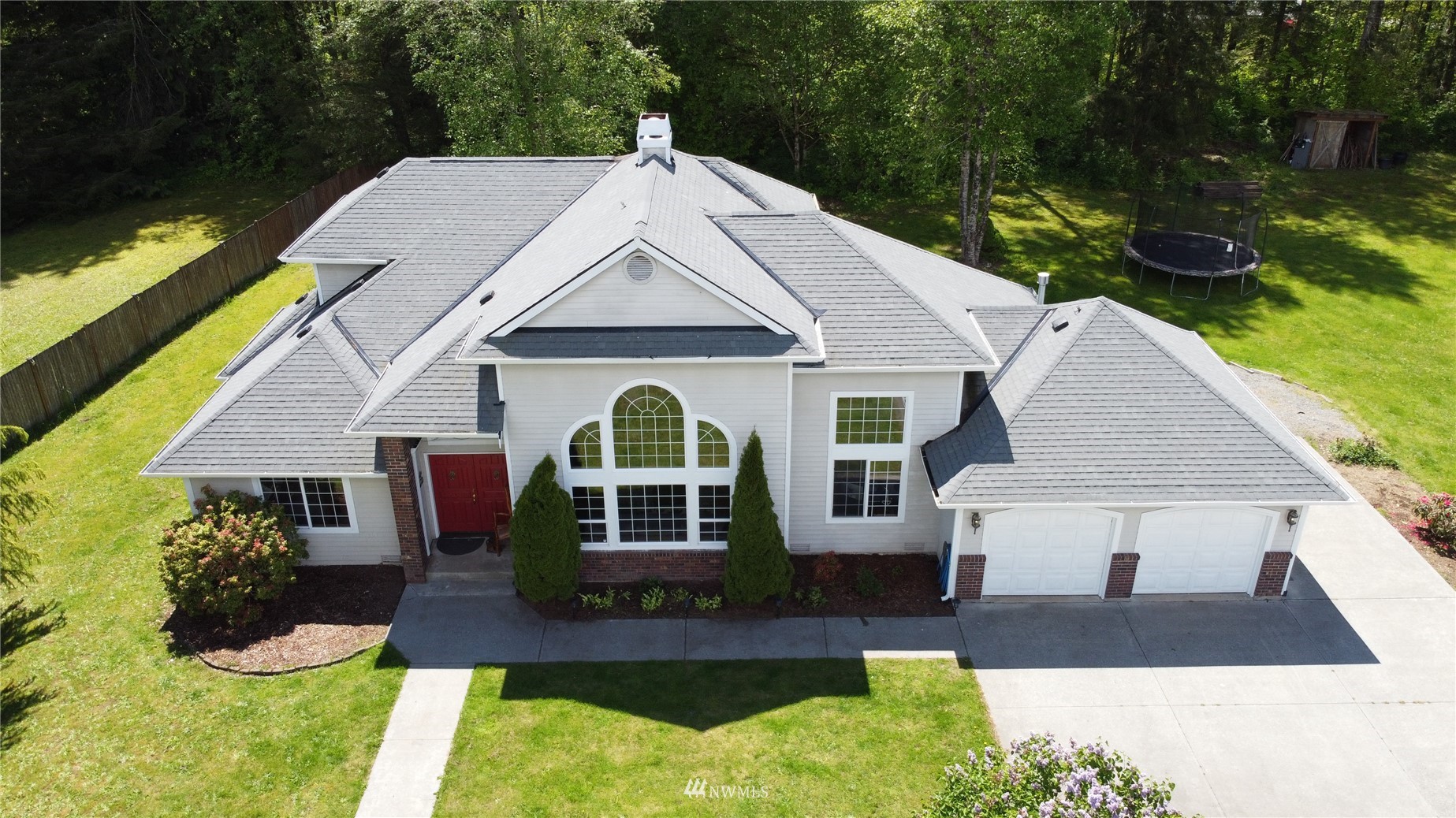8235 Lusk Road Concrete, WA 98237 - Photo 1 of 40 a front view of a house with garden
