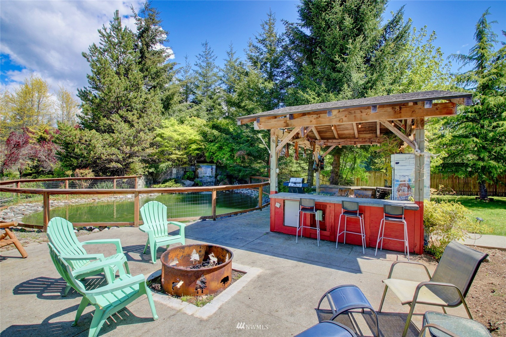 8235 Lusk Road Concrete, WA 98237 - Photo 11 of 40 an outdoor sitting area with furniture and garden view