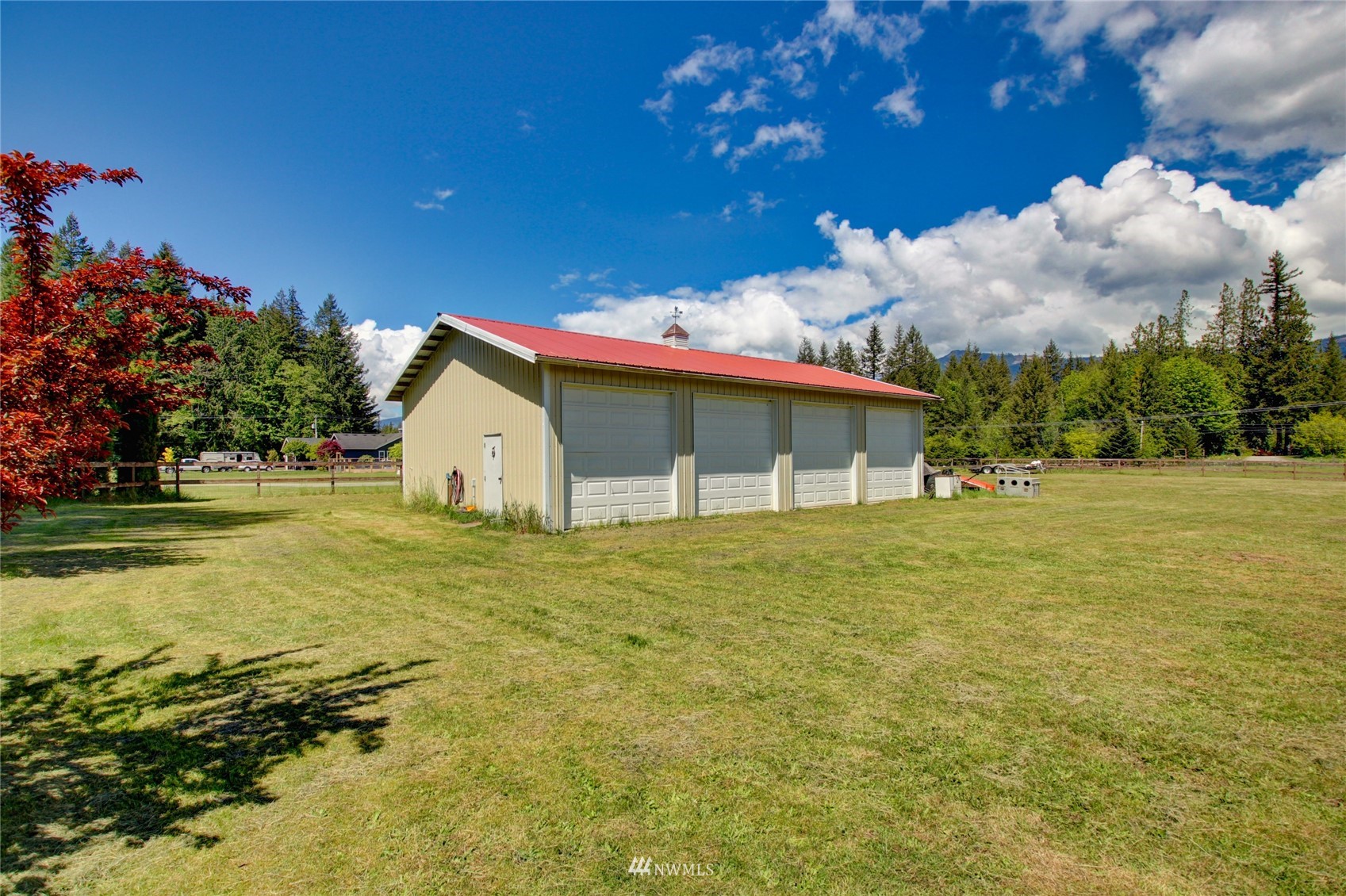 8235 Lusk Road Concrete, WA 98237 - Photo 16 of 40 a view of a house with pool and a yard