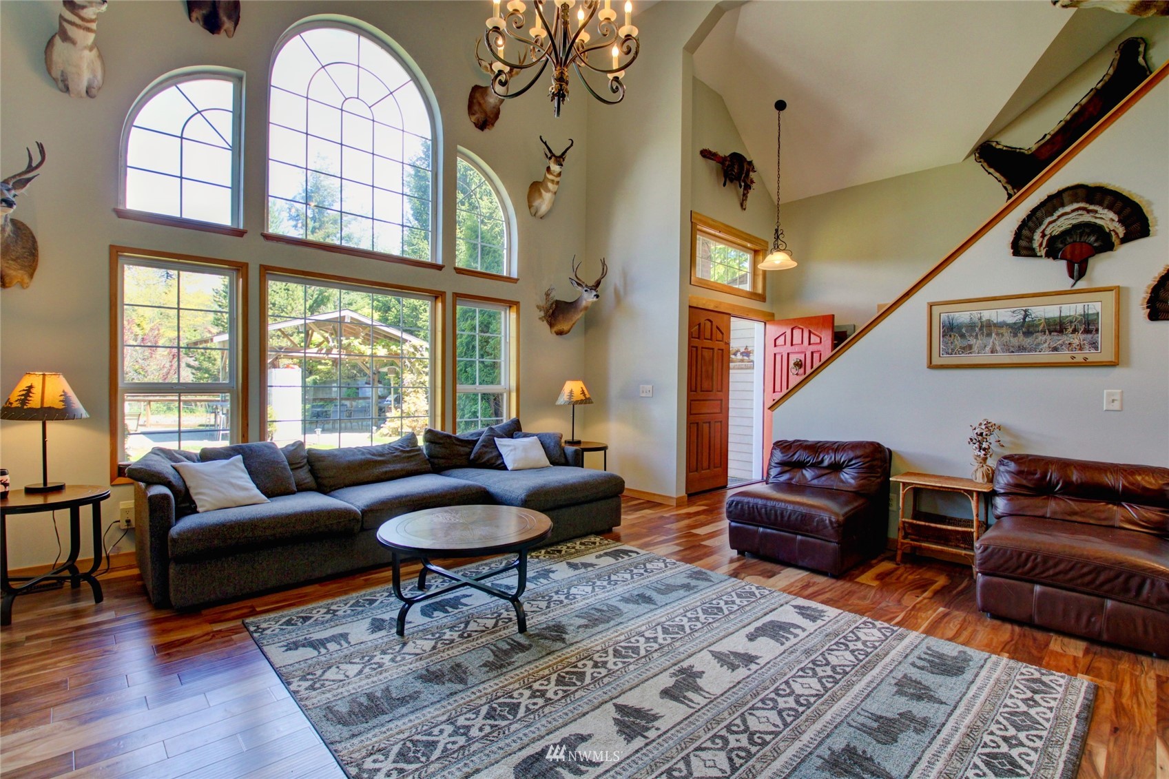 8235 Lusk Road Concrete, WA 98237 - Photo 21 of 40 a living room with furniture a rug and a large window