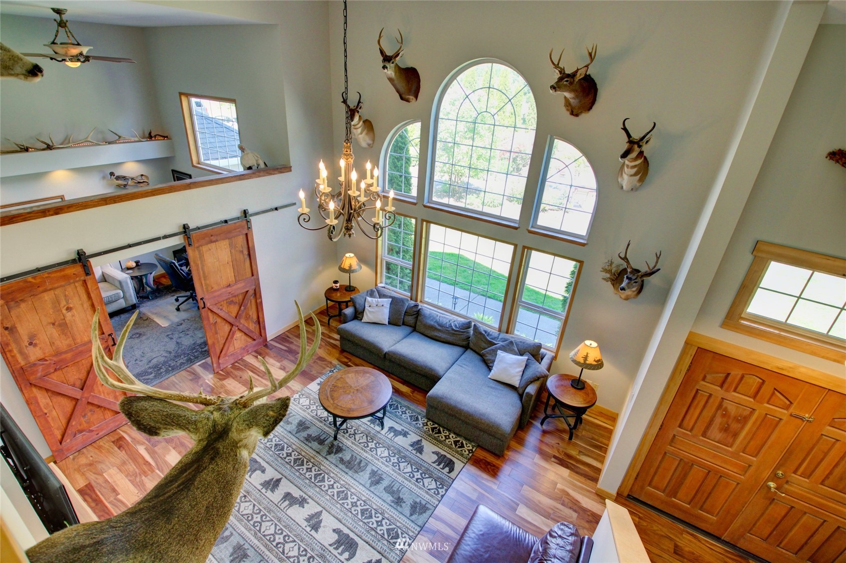 8235 Lusk Road Concrete, WA 98237 - Photo 22 of 40 a living room with furniture and a floor to ceiling window