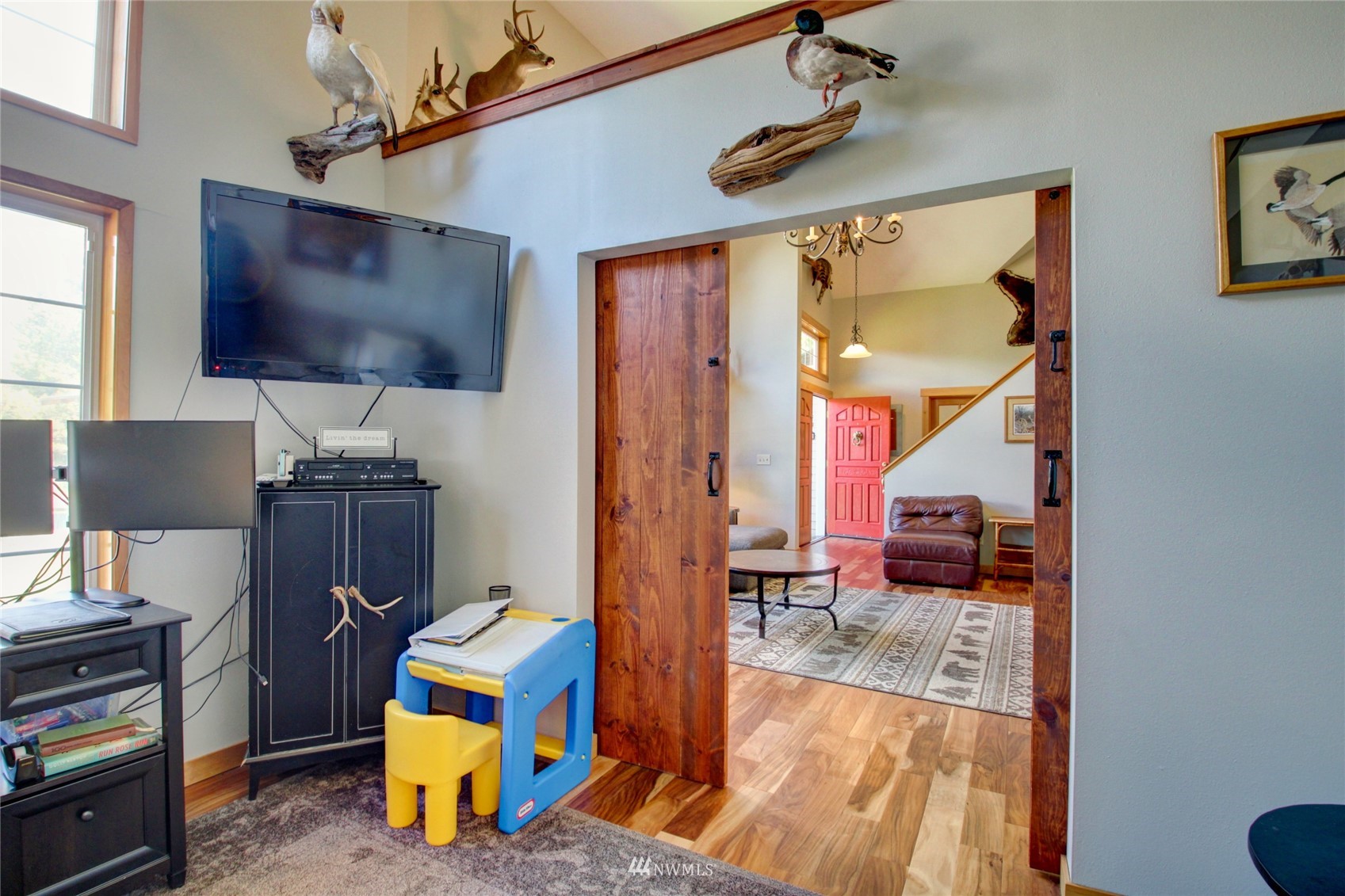 8235 Lusk Road Concrete, WA 98237 - Photo 25 of 40 a living room with furniture and a flat screen tv