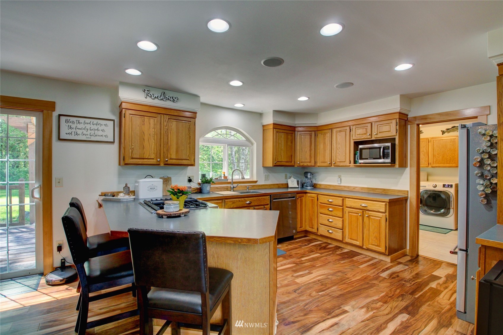 8235 Lusk Road Concrete, WA 98237 - Photo 26 of 40 a kitchen with a sink cabinets and wooden floor
