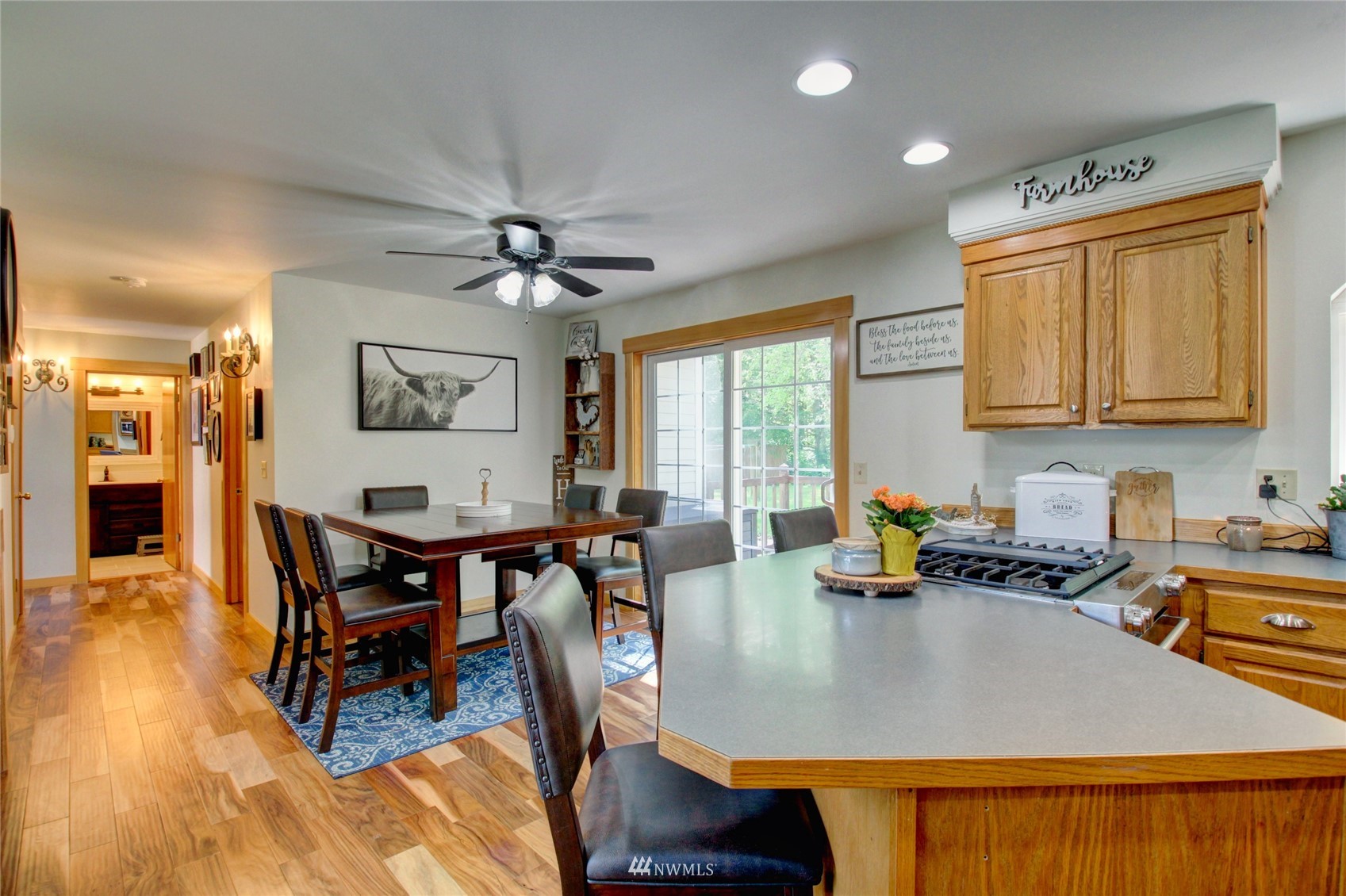 8235 Lusk Road Concrete, WA 98237 - Photo 29 of 40 a view of a dining room with furniture window and wooden floor