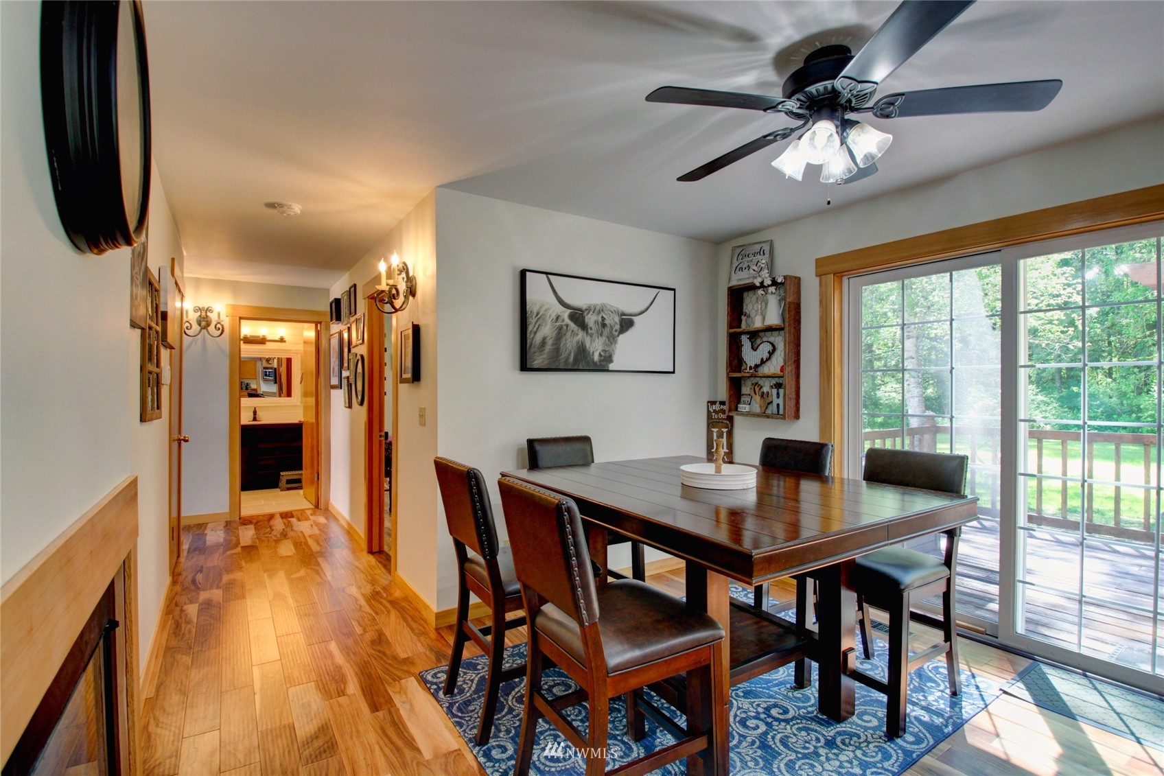 8235 Lusk Road Concrete, WA 98237 - Photo 30 of 40 a view of a dining room with furniture window and wooden floor