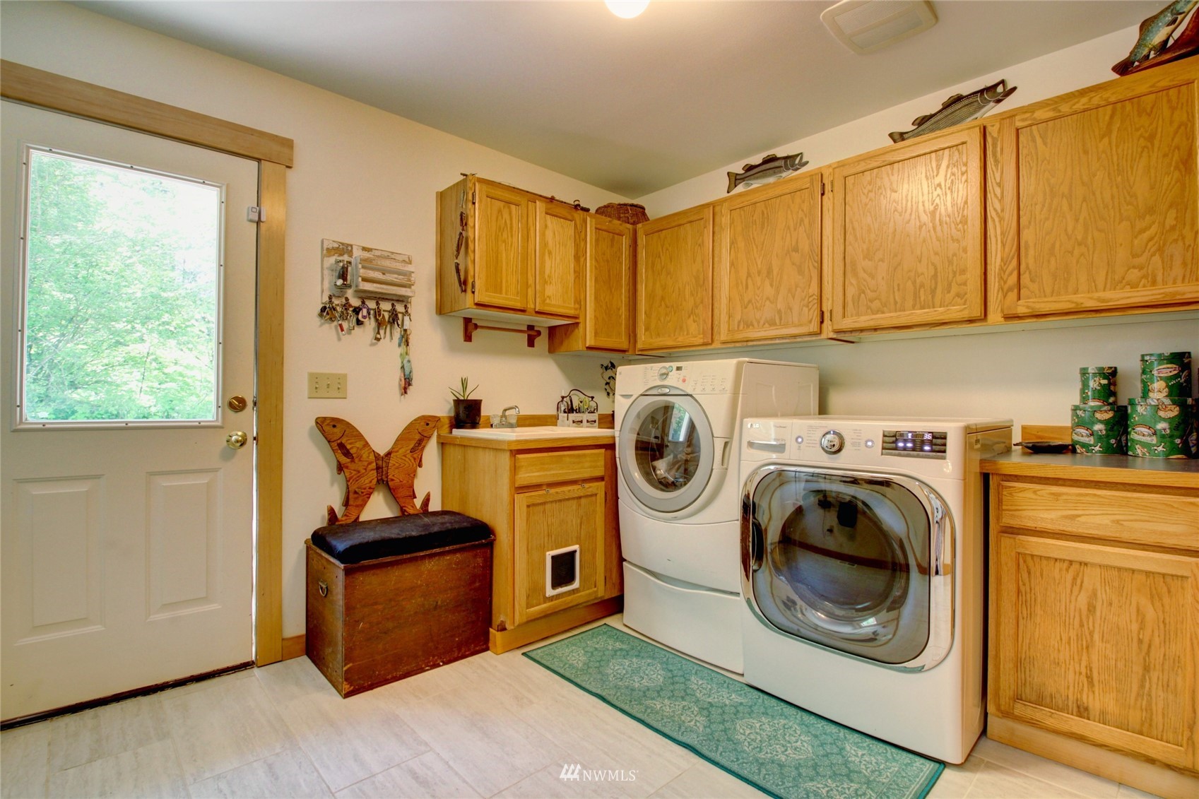 8235 Lusk Road Concrete, WA 98237 - Photo 31 of 40 a utility room with sink dryer and washer