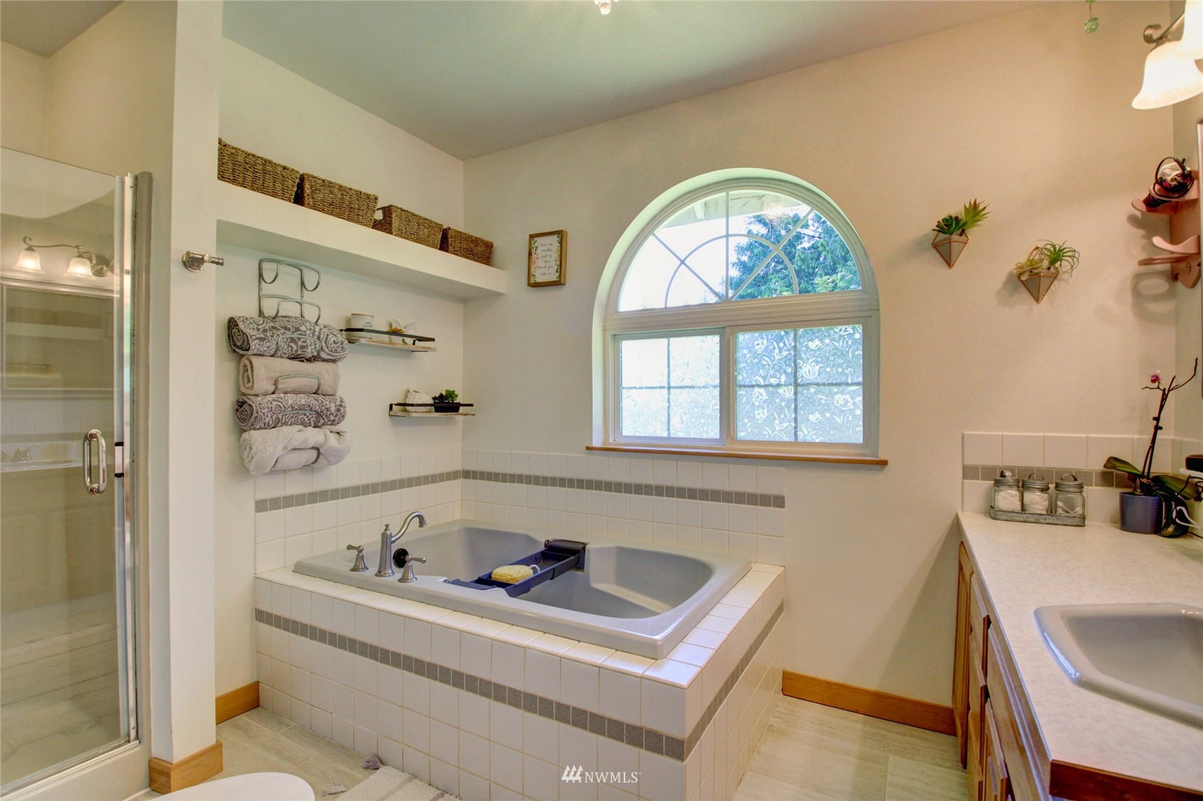 8235 Lusk Road Concrete, WA 98237 - Photo 34 of 40 a bathroom with a bathtub and a window