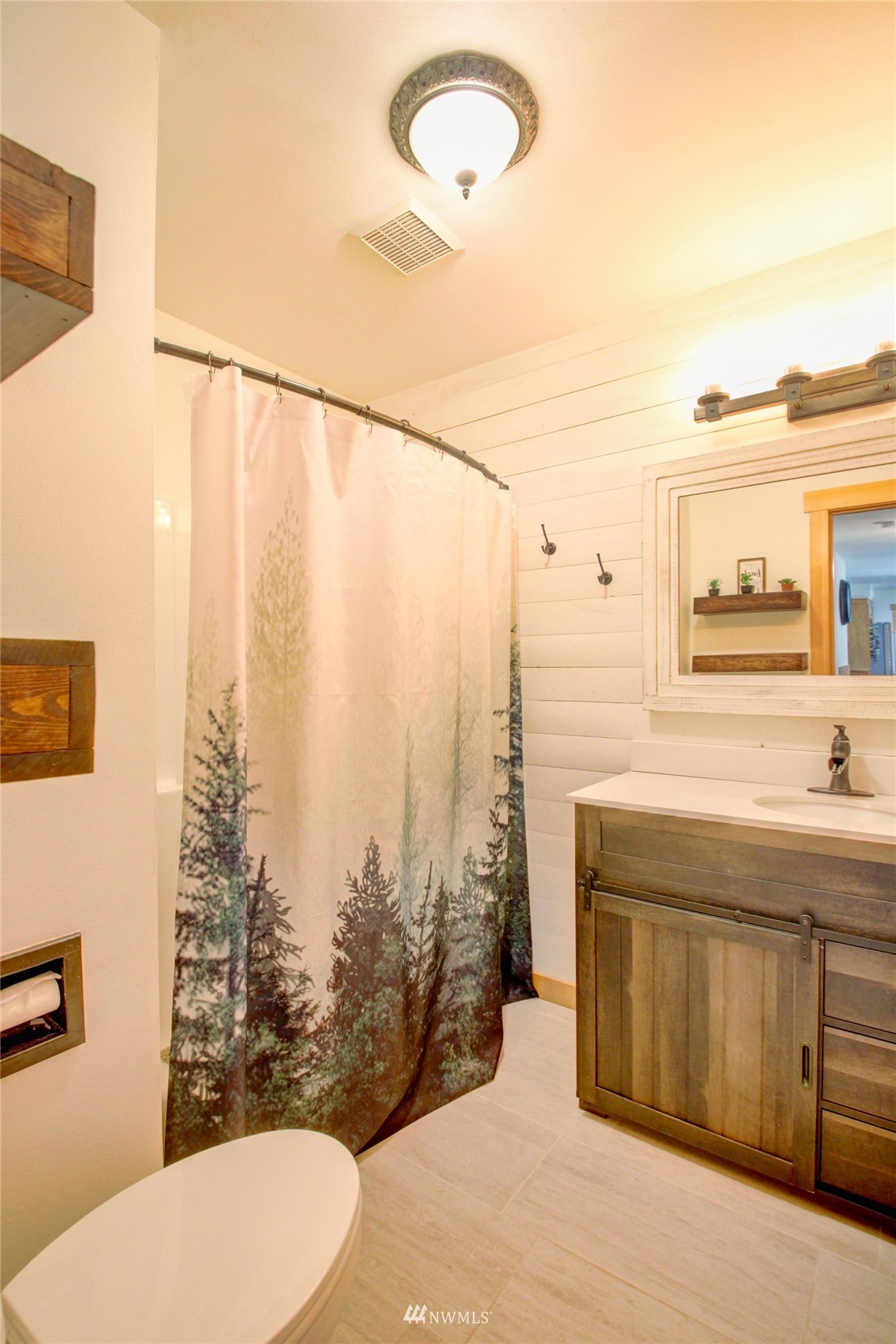 8235 Lusk Road Concrete, WA 98237 - Photo 37 of 40 a bathroom with a sink a toilet and shower curtain
