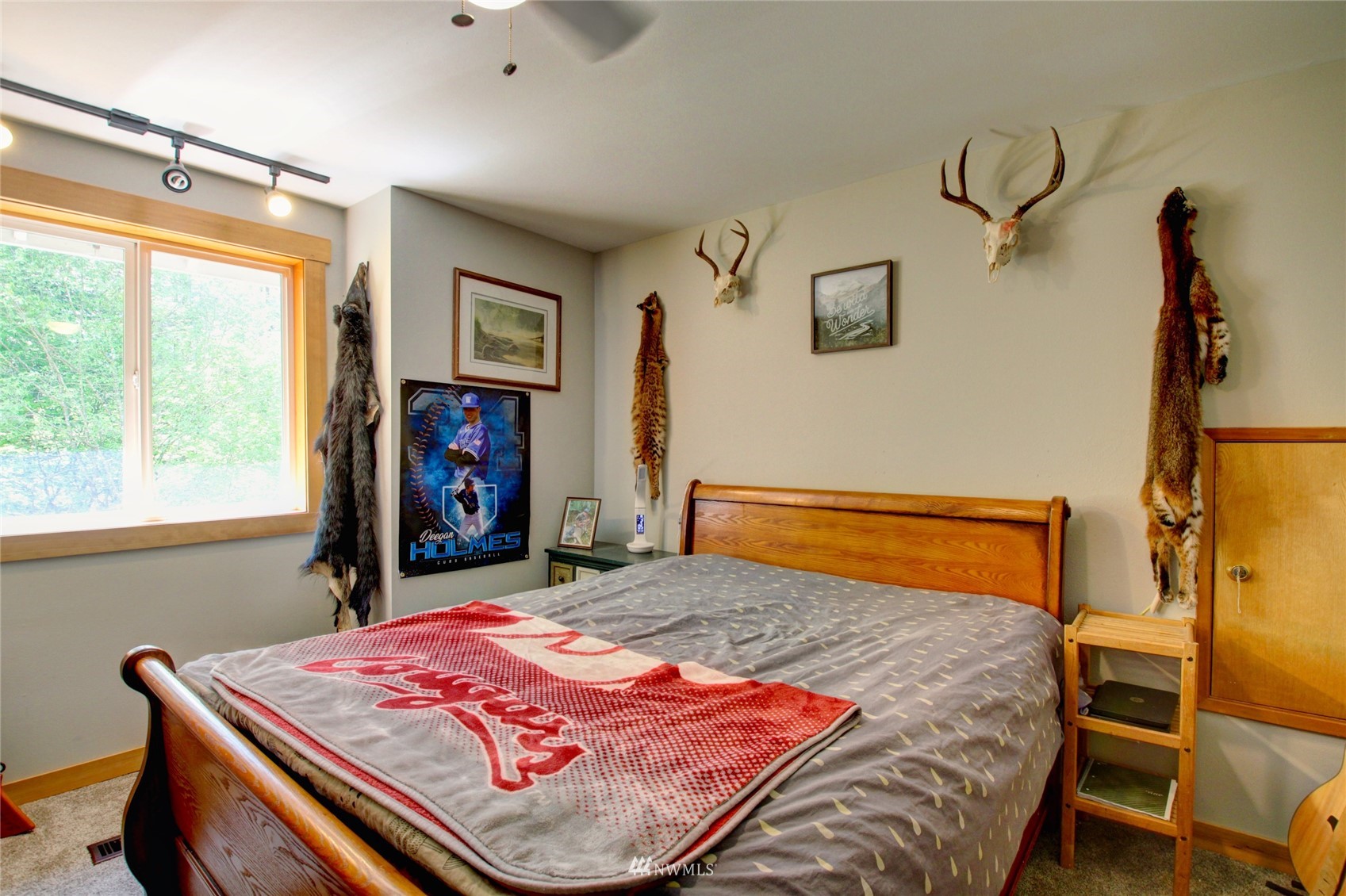 8235 Lusk Road Concrete, WA 98237 - Photo 40 of 40 a bedroom with a bed and wooden floor