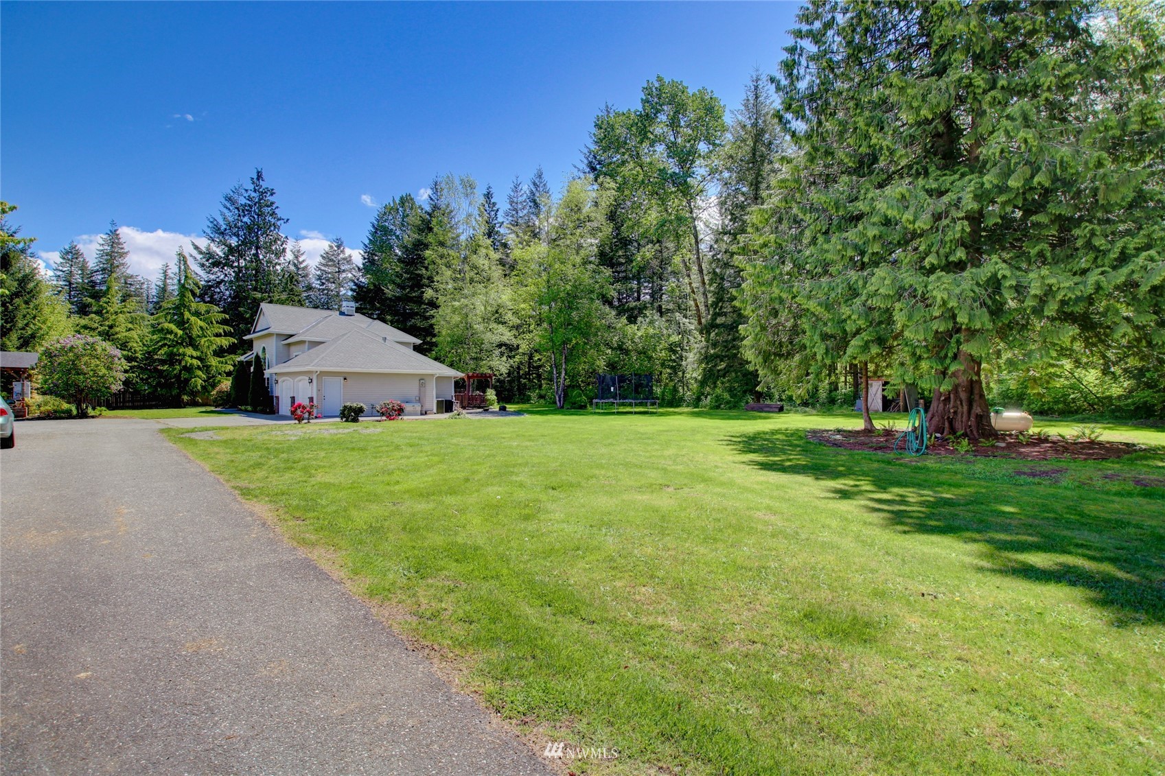 8235 Lusk Road Concrete, WA 98237 - Photo 6 of 40 a view of a house with yard and tree s