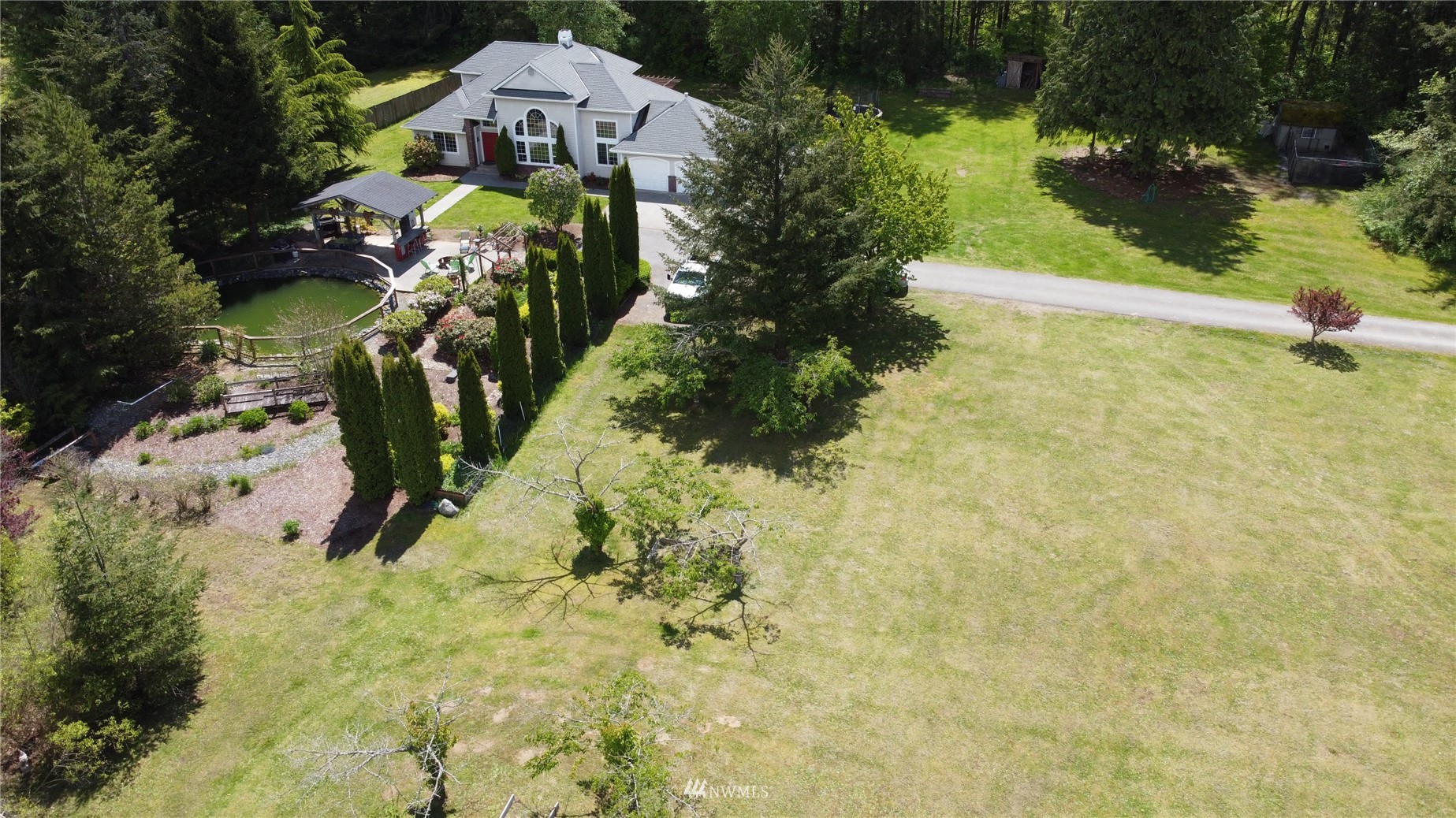 8235 Lusk Road Concrete, WA 98237 - Photo 7 of 40 a view of swimming pool from a garden