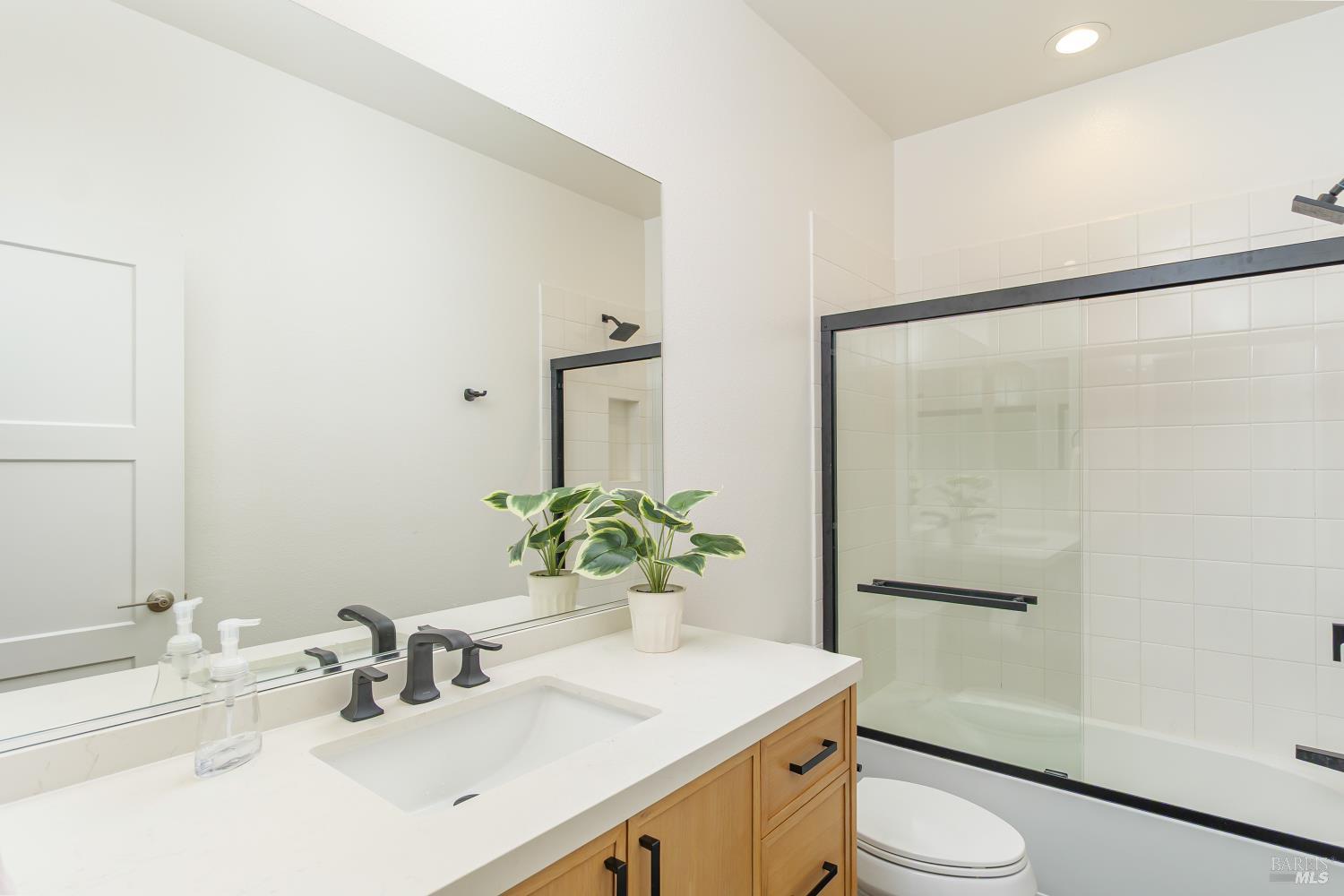 715 Rockview Road Novato, CA 94949 - Photo 11 of 35 Additional photo of the full bath off hallway with beautiful stone top vanity, enclosed tub and shower.