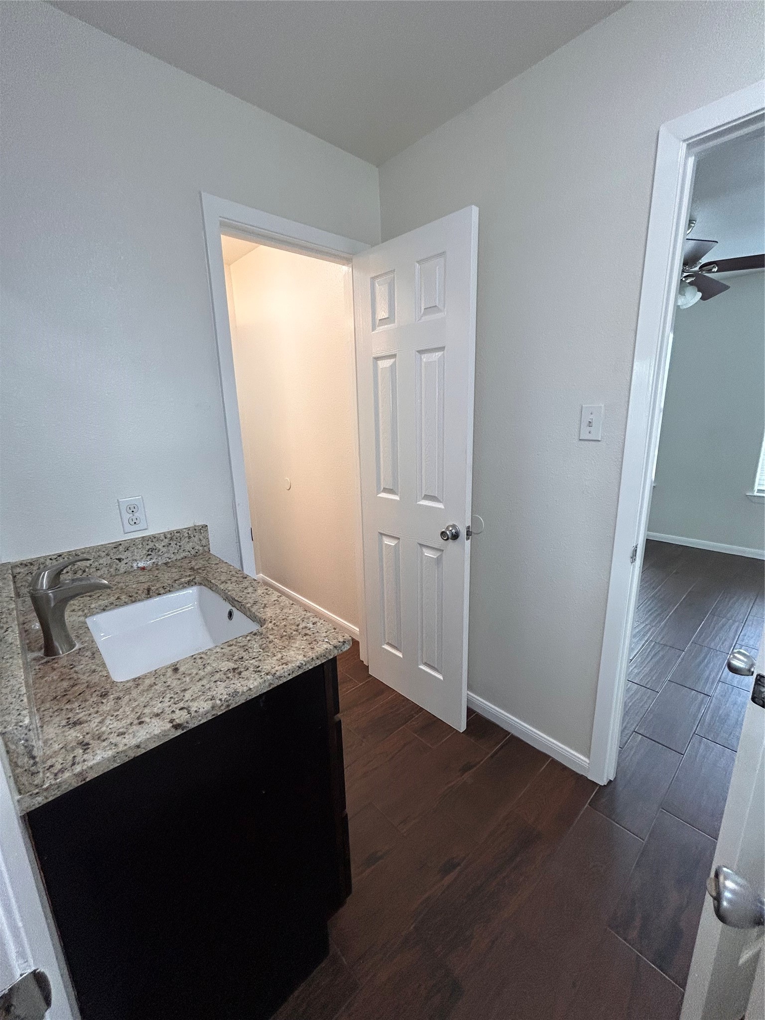 6837 Larkstone Street, Unit A Houston, TX 77028 - Photo 12 of 18 a bathroom with a granite countertop sink and a mirror
