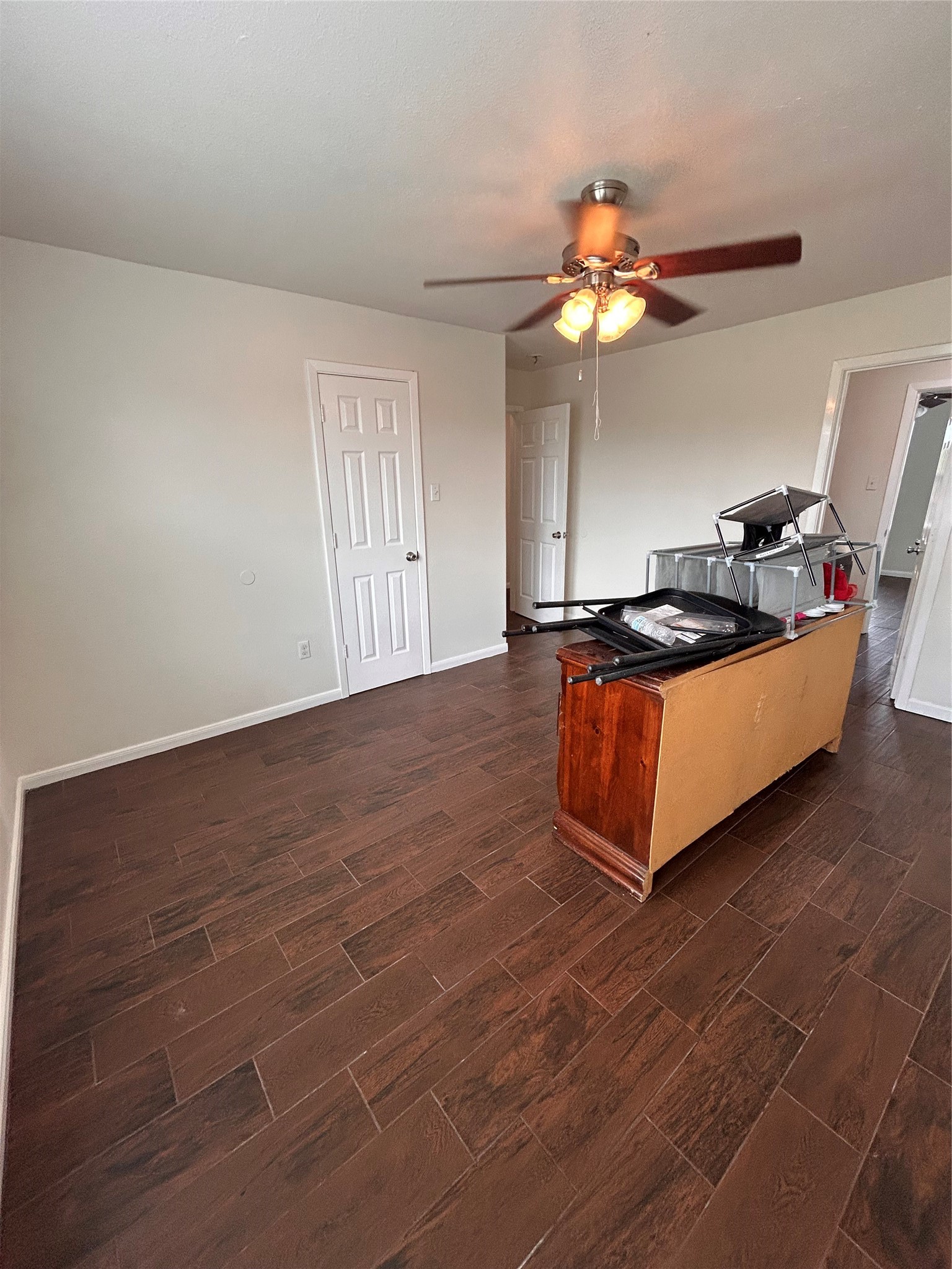 6837 Larkstone Street, Unit A Houston, TX 77028 - Photo 13 of 18 a living room with furniture a dining table and a chandelier