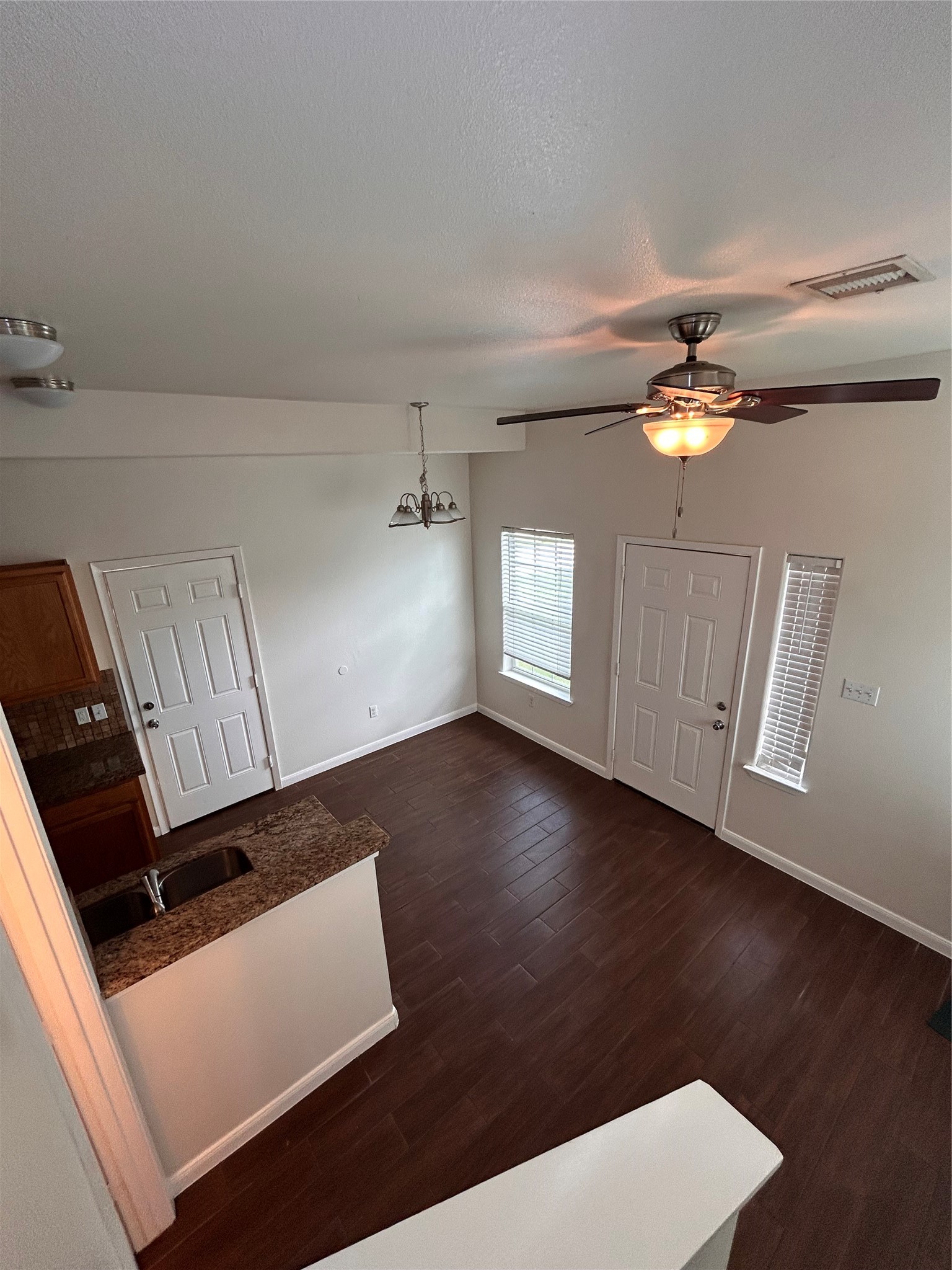6837 Larkstone Street, Unit A Houston, TX 77028 - Photo 2 of 18 wooden floor in an empty room with a window
