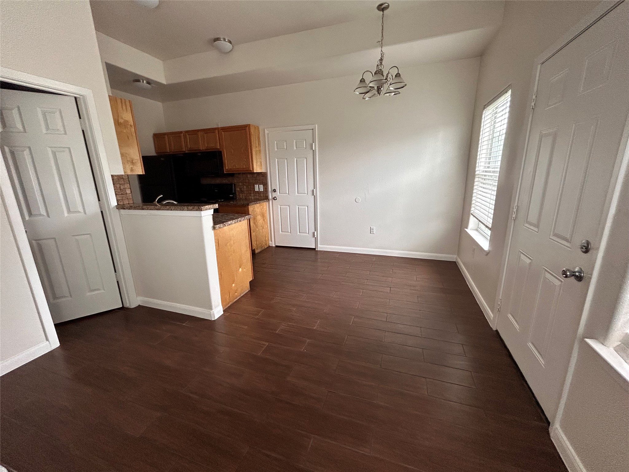 6837 Larkstone Street, Unit A Houston, TX 77028 - Photo 4 of 18 a view of empty room with wooden floor and fan