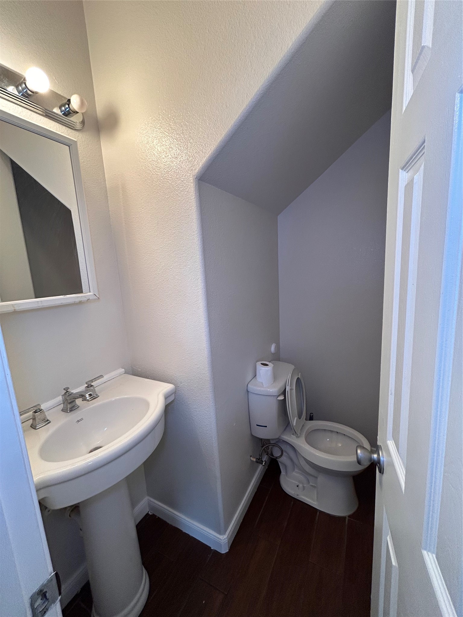 6837 Larkstone Street, Unit A Houston, TX 77028 - Photo 5 of 18 a bathroom with a sink mirror and toilet