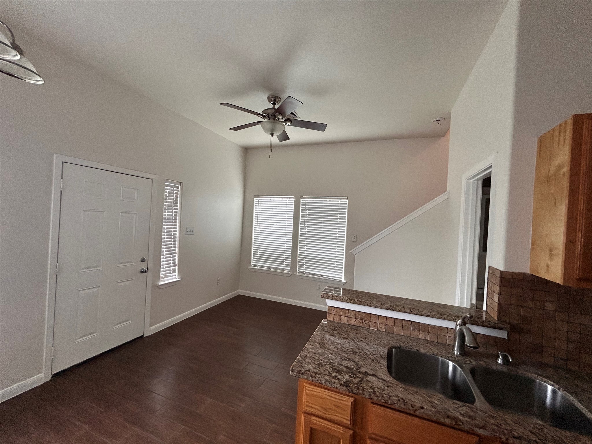 6837 Larkstone Street, Unit A Houston, TX 77028 - Photo 6 of 18 a kitchen with granite countertop a sink stainless steel appliances and cabinets