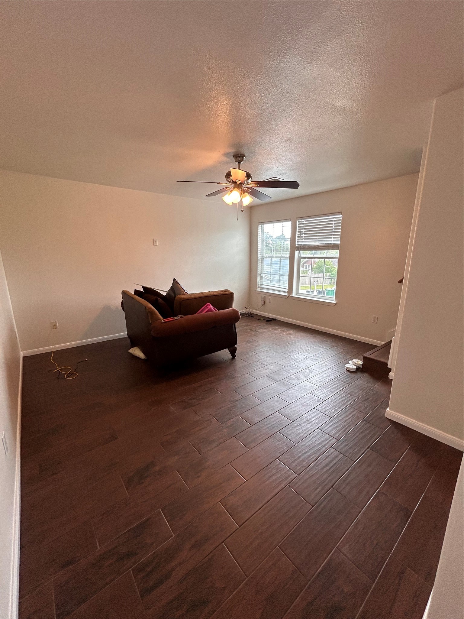 6837 Larkstone Street, Unit A Houston, TX 77028 - Photo 8 of 18 wooden floor in an empty room with a window
