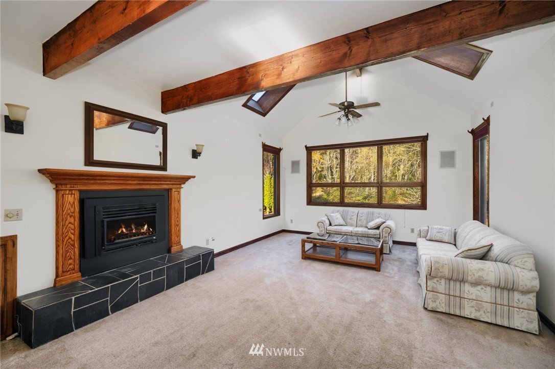 4566 Anderson Way Bellingham, WA 98226 - Photo 23 of 29 a living room with furniture and a fireplace
