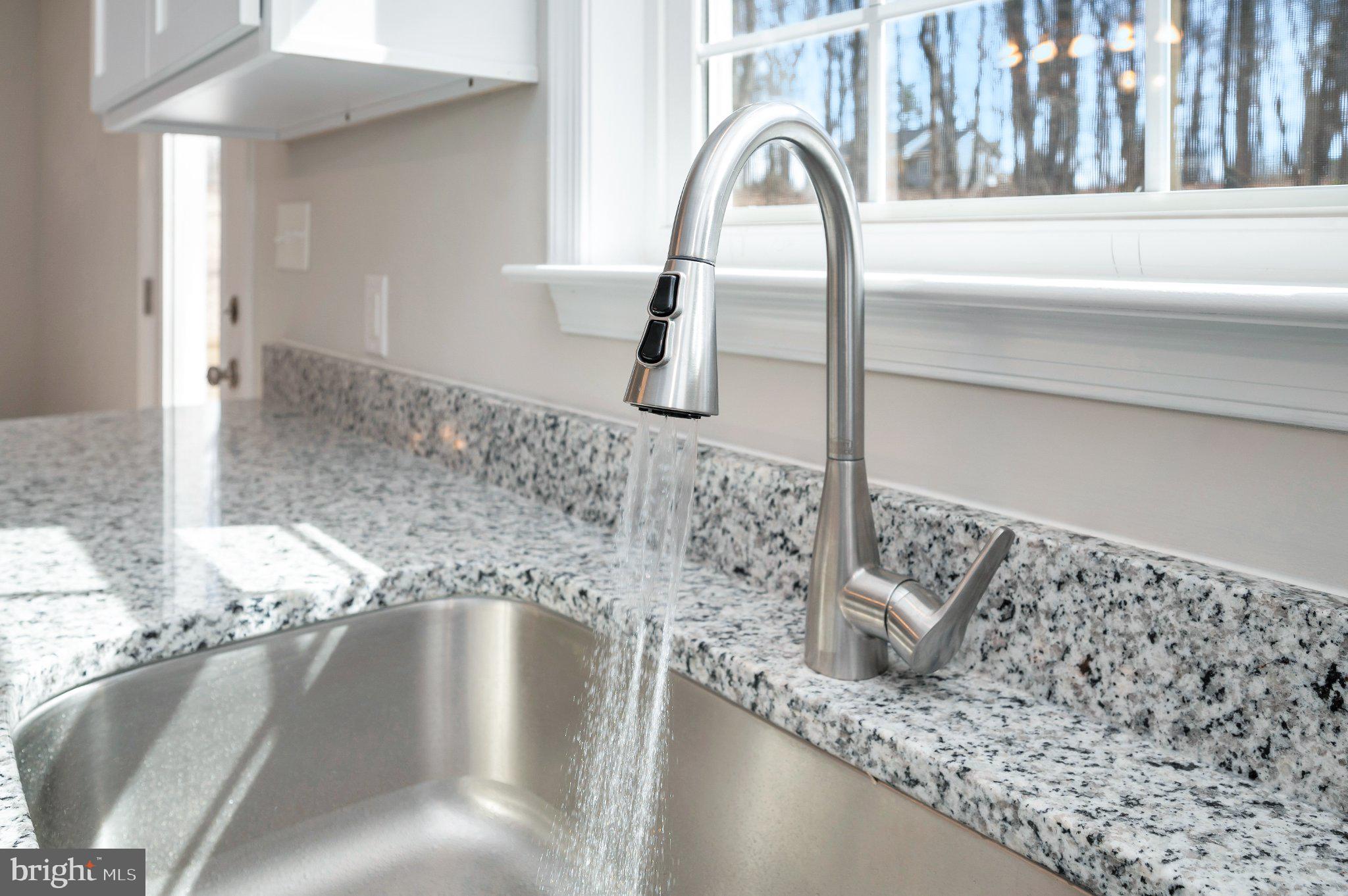 28150 Tatum Road Unionville, VA 22567 - Photo 15 of 28 Sleek faucet with flowing water.