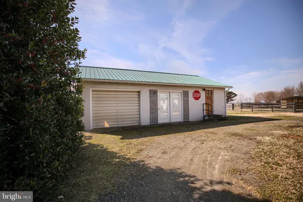 a front view of a house with garage