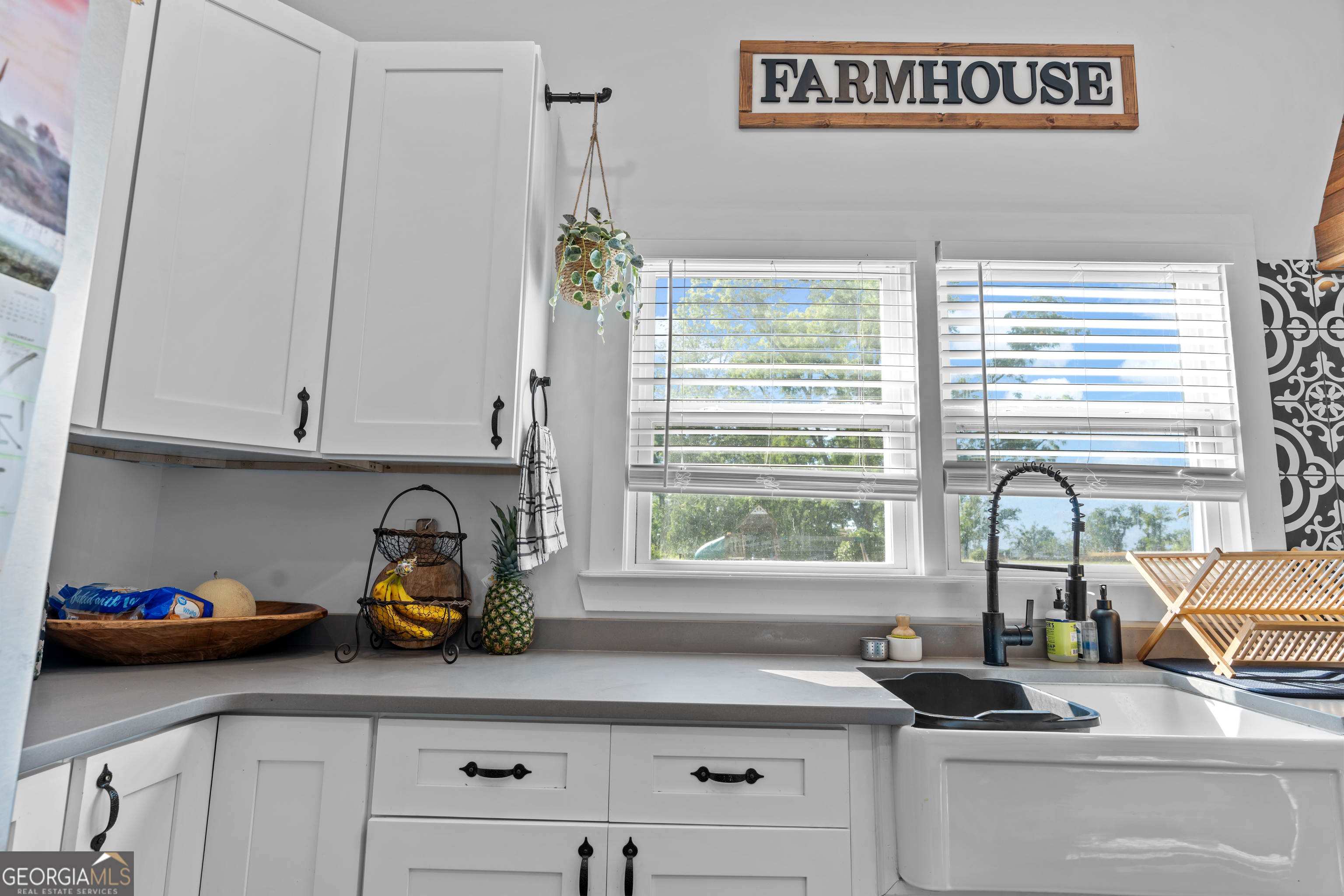 5065 10 Mile Road Baxley, GA 31513 - Photo 32 of 70 a kitchen with a window a sink and cabinets