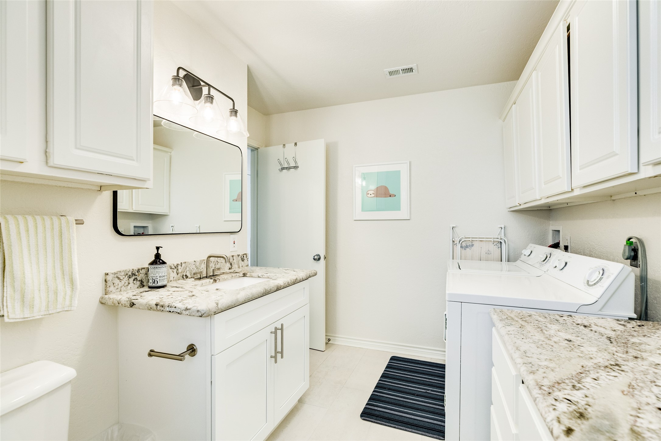 23331 Termini-San Luis Pass Road Galveston, TX 77554 - Photo 11 of 28 a bathroom with a sink and a mirror