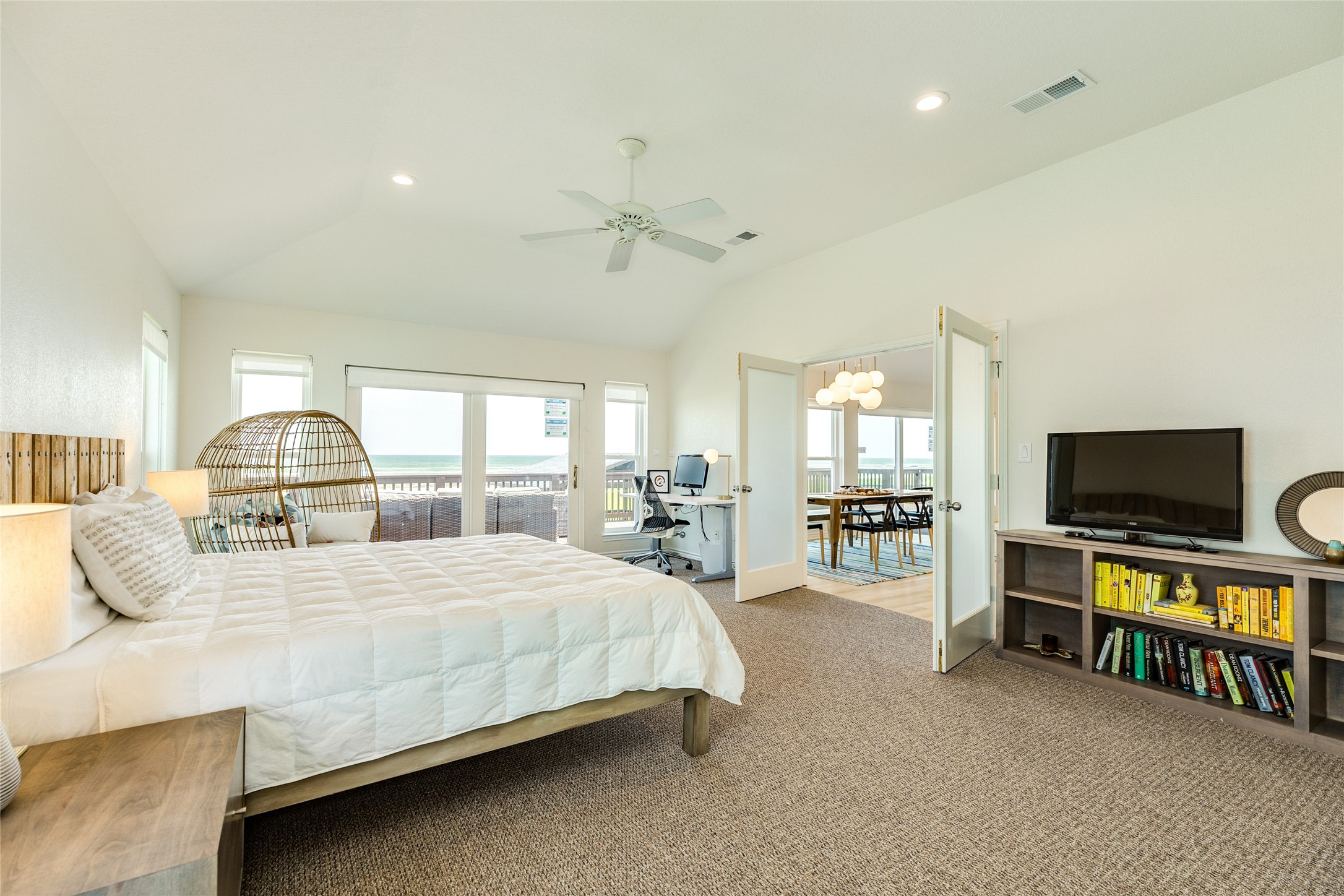 23331 Termini-San Luis Pass Road Galveston, TX 77554 - Photo 13 of 28 a bedroom with a bed and a flat screen tv
