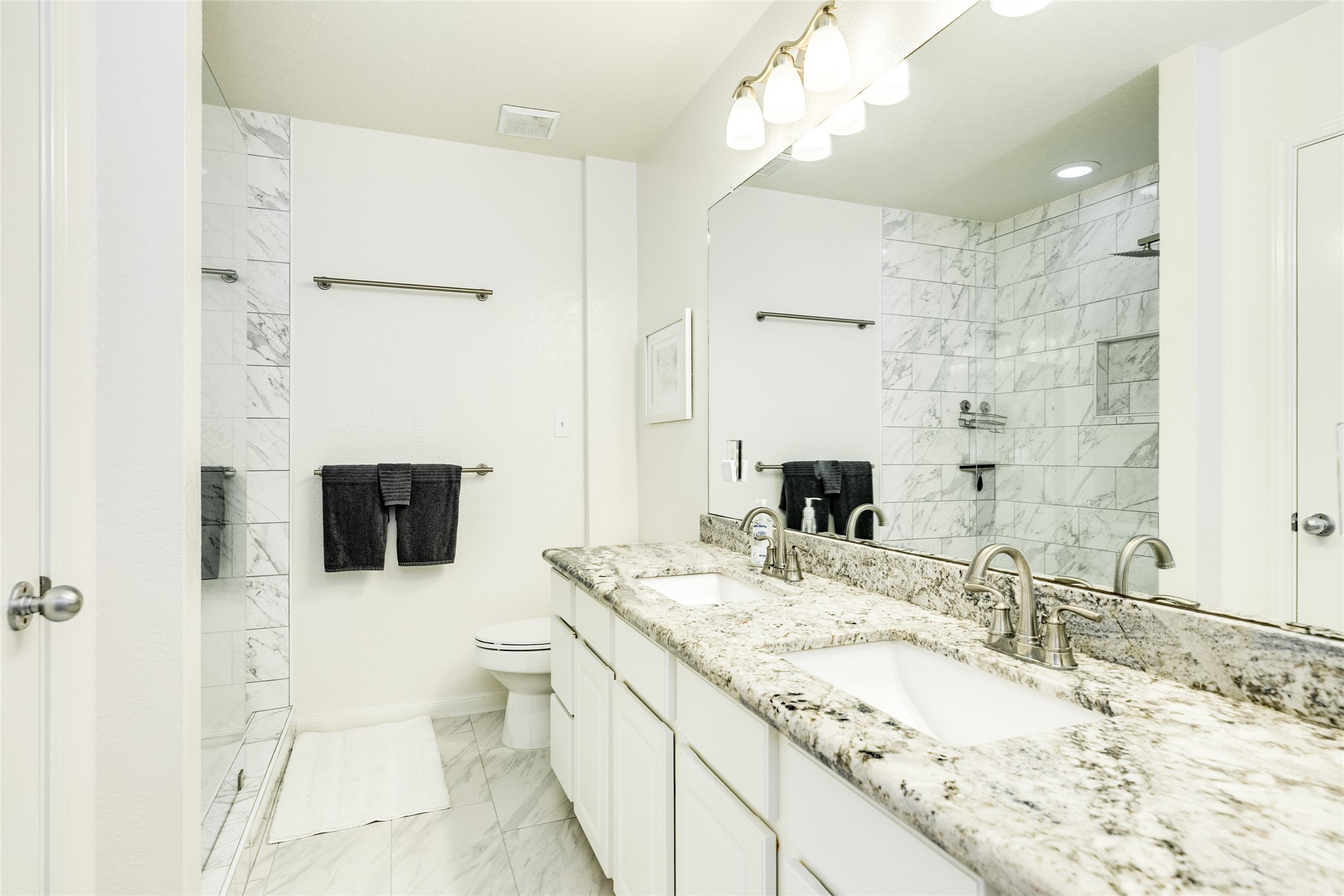 23331 Termini-San Luis Pass Road Galveston, TX 77554 - Photo 15 of 28 a bathroom with a granite countertop sink mirror and toilet