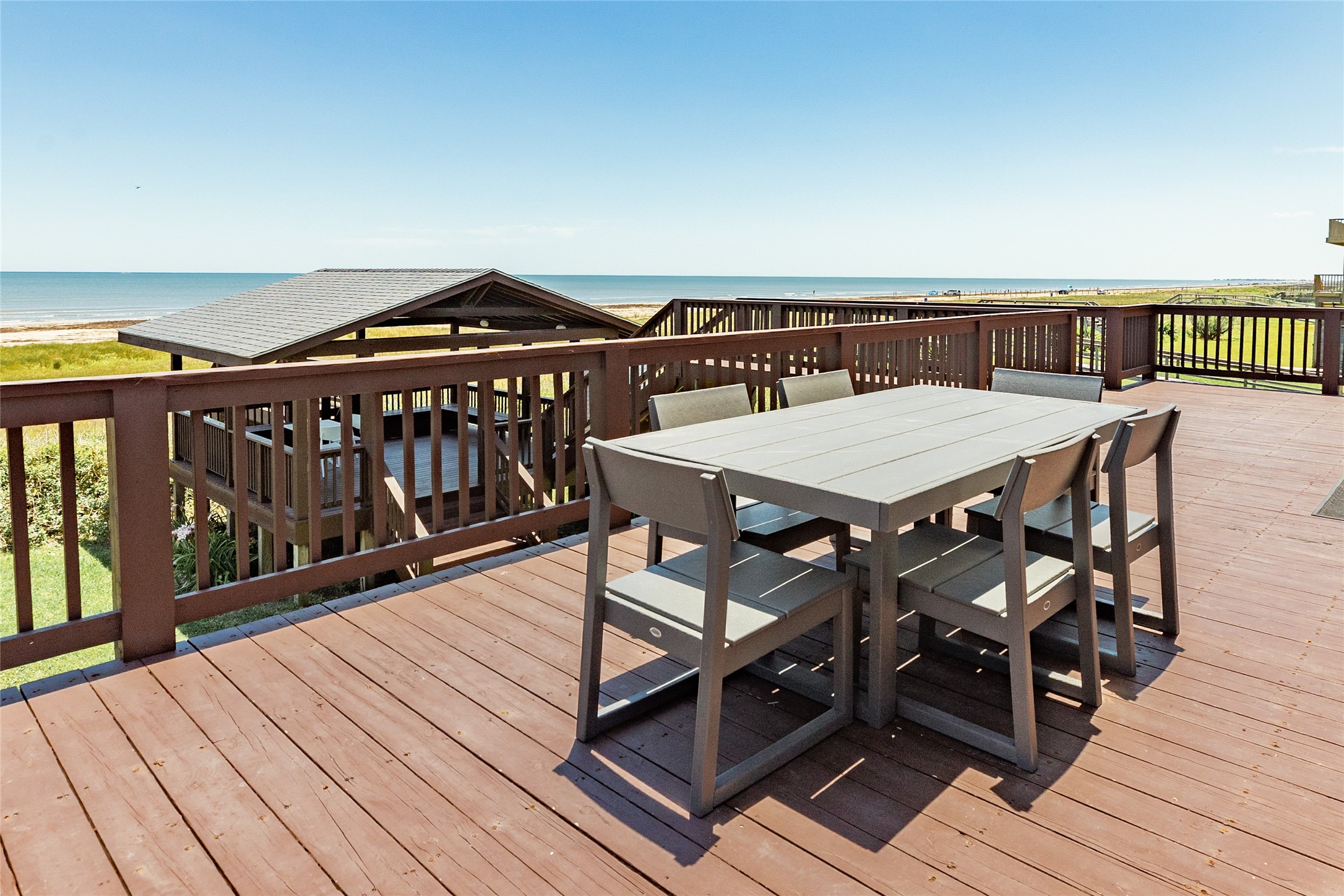 23331 Termini-San Luis Pass Road Galveston, TX 77554 - Photo 28 of 28 a view of a roof deck with wooden floor and furniture