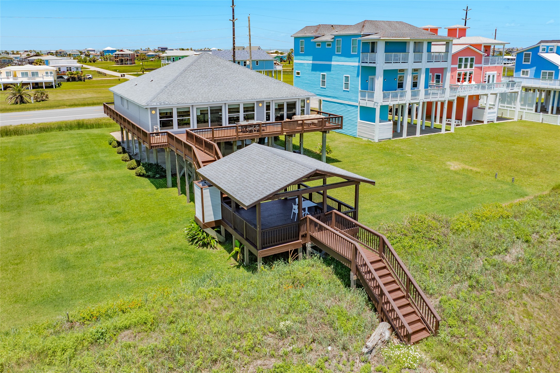 23331 Termini-San Luis Pass Road Galveston, TX 77554 - Photo 3 of 28 aerial view of a house with swimming pool outdoor seating and city view
