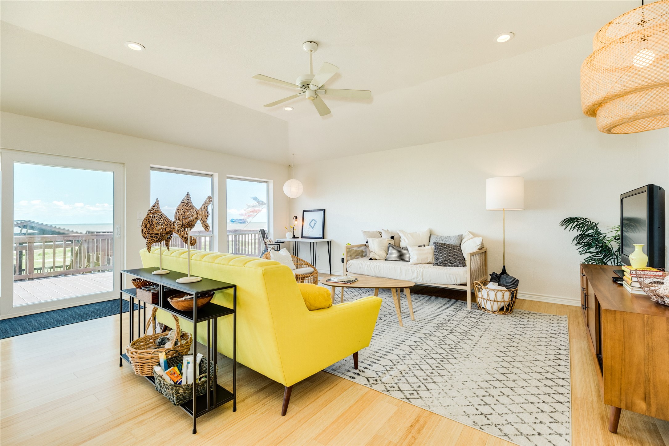 23331 Termini-San Luis Pass Road Galveston, TX 77554 - Photo 5 of 28 a living room with furniture and a chandelier