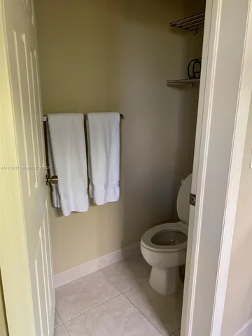 a living room with a flat screen tv and a fireplace