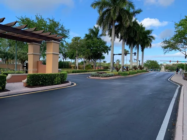 a view of a house with a swimming pool and sitting area