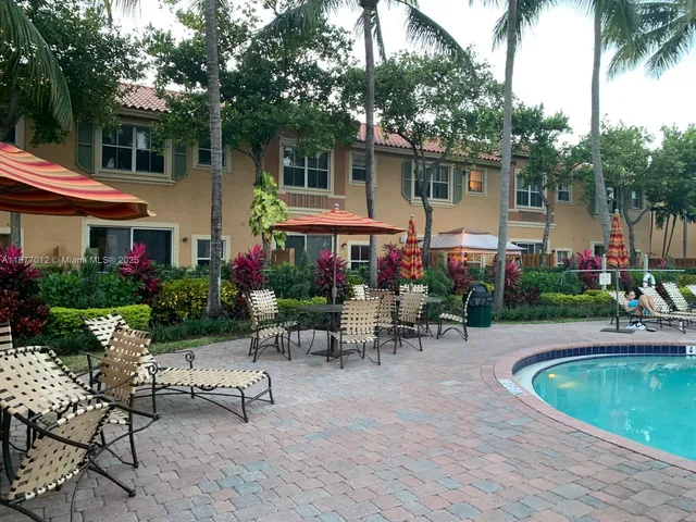 a view of swimming pool yard from a lake view