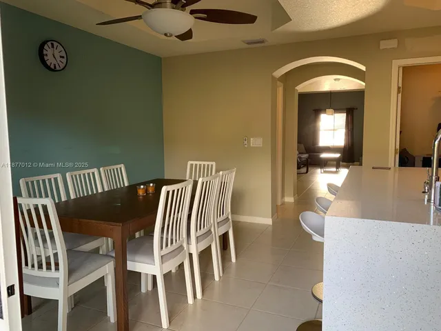 a kitchen with a stove and a refrigerator