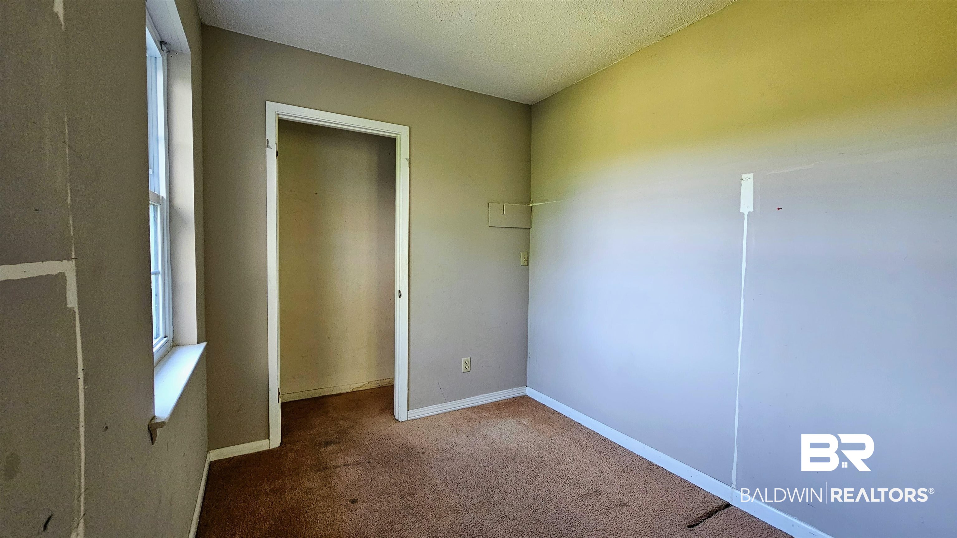 18824 Highway 41 Brewton, AL 36426 - Photo 33 of 40 Room featuring carpeted flooring and a single window with a white frame