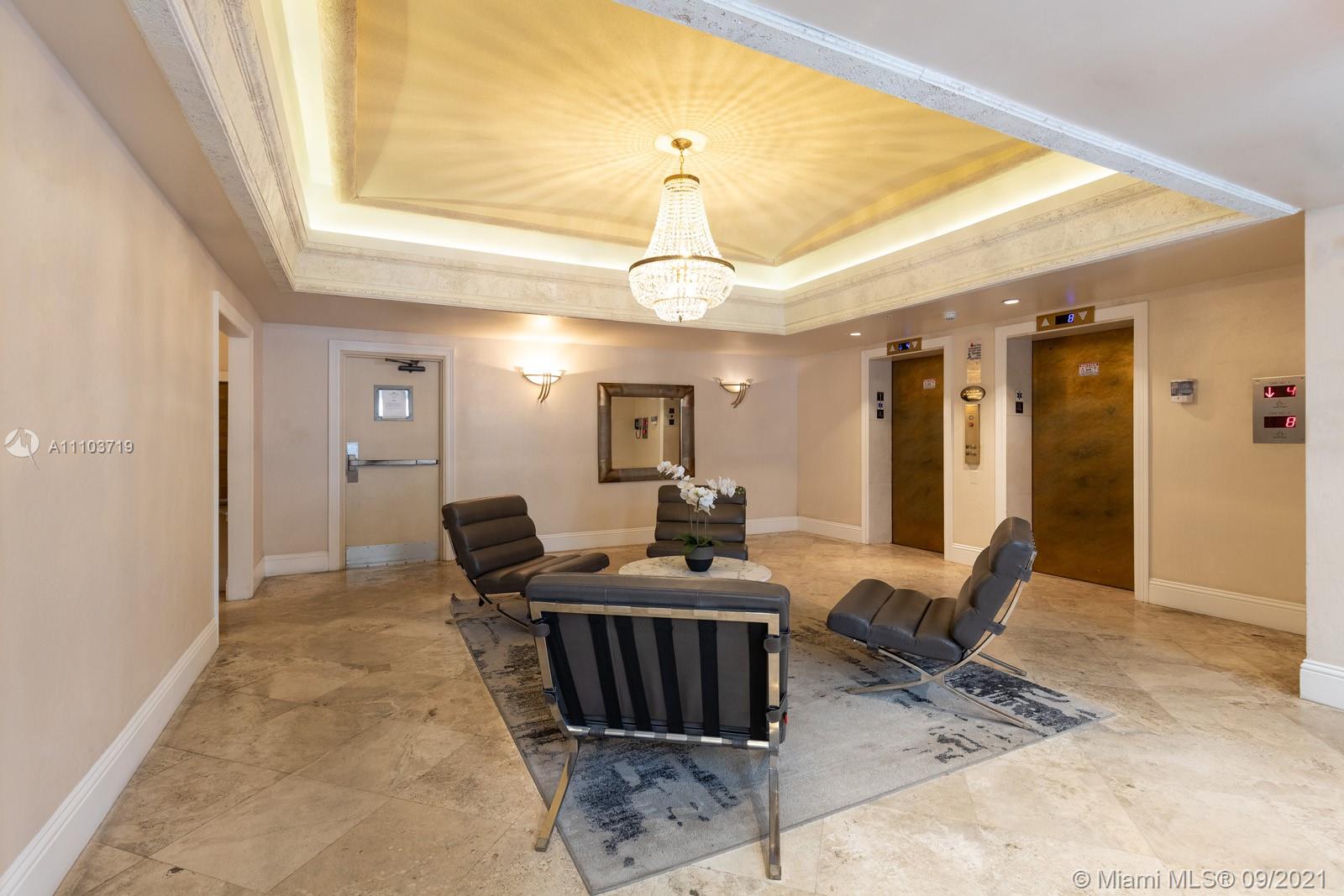 9195 Collins Avenue, Unit 710 Surfside, FL 33154 - Photo 9 of 15 a living room with furniture a dining table and chairs