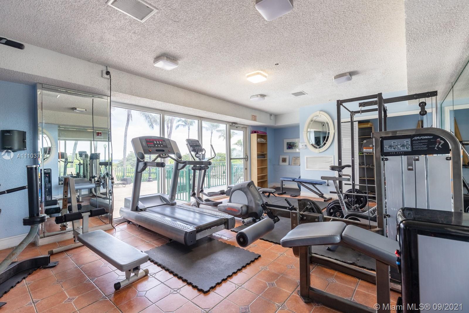 9195 Collins Avenue, Unit 710 Surfside, FL 33154 - Photo 10 of 15 a living room with furniture and floor to ceiling window