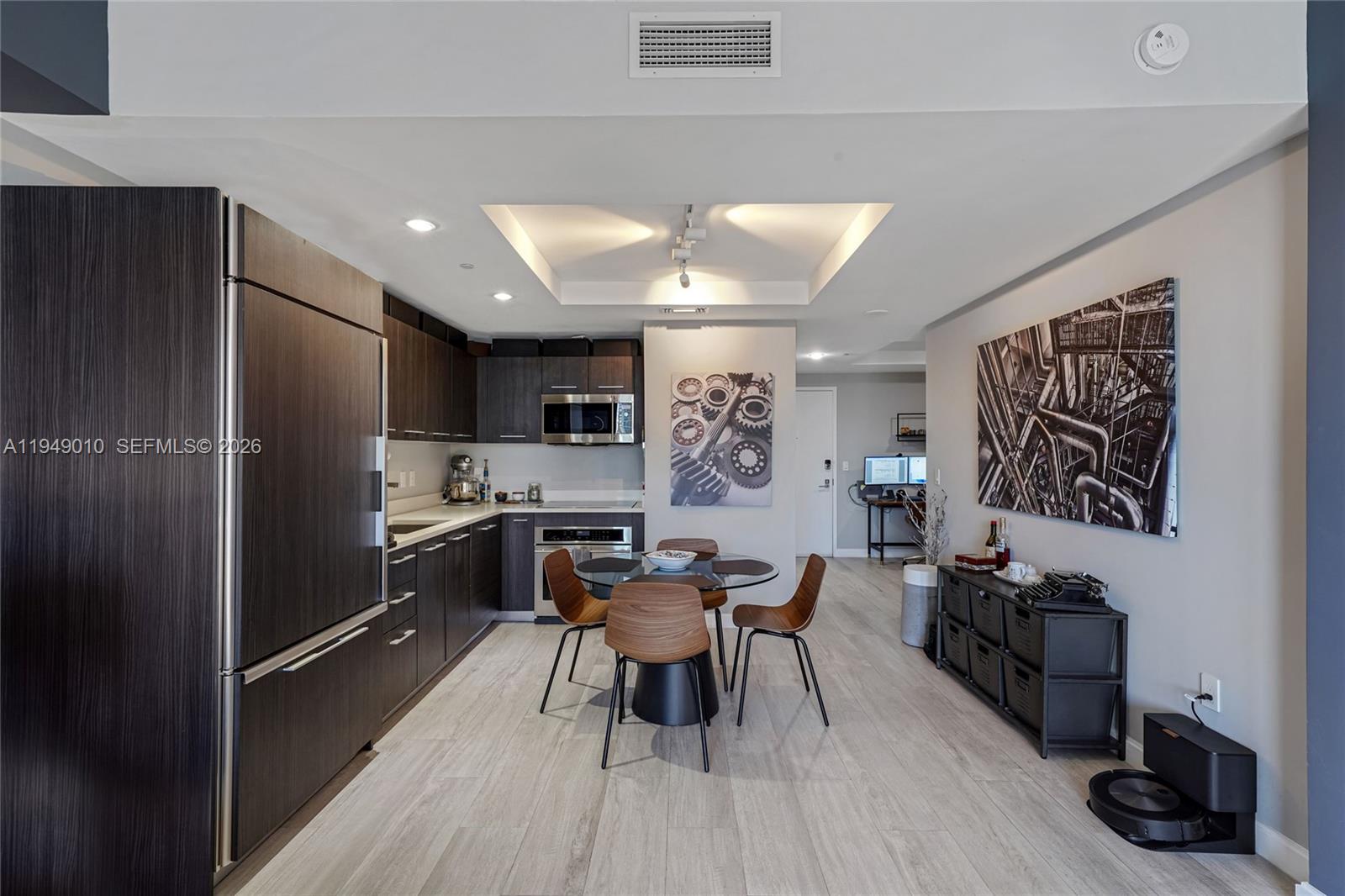 45 Southwest 9th Street, Unit 3405 Miami, FL 33130 - Photo 3 of 47 a kitchen with stainless steel appliances a refrigerator and a stove top oven