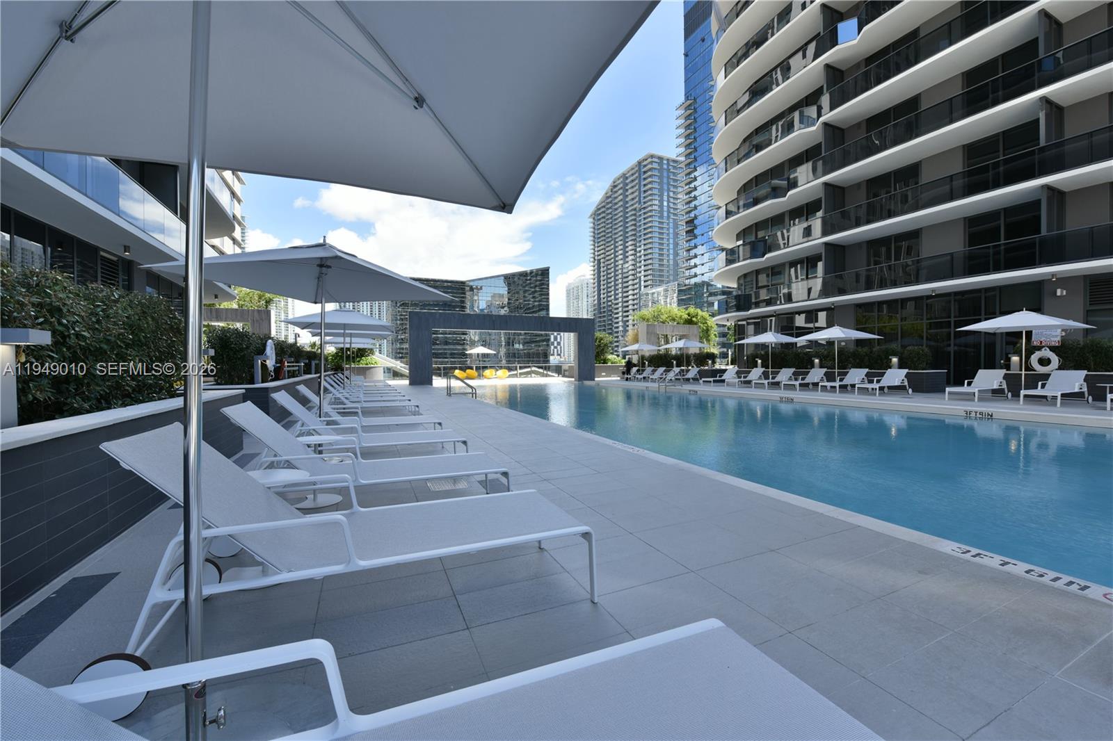 45 Southwest 9th Street, Unit 3405 Miami, FL 33130 - Photo 34 of 47 a view of a swimming pool with a patio